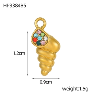 Macro detail of a gold shell pendant with colorful zircons and size dimensions