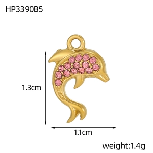 Macro view of gold-plated dolphin pendant with pink cubic zirconia and size dimensions