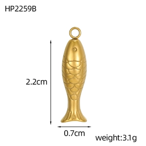 Macro view of koi fish pendant with scale texture, 2.2cm by 0.7cm gold stainless steel charm