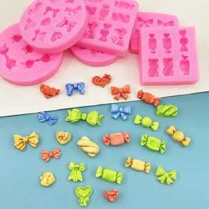 DIY silicone mold featuring pink candy shapes, bows and love hearts for baking and resin crafts