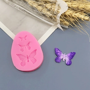 Pink silicone butterfly mold for fondant and chocolate with 3D textured wing details