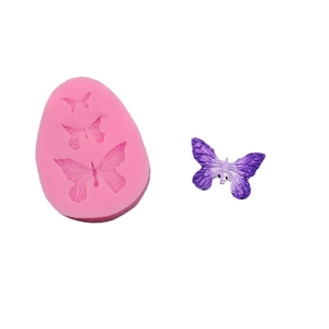 Pink silicone bow mold for fondant and chocolate with 3D butterfly texture detail