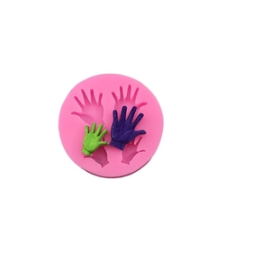 Pink silicone round mold featuring four handprint cavities for fondant and DIY baking