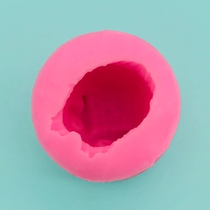 Detailed top view of pink silicone owl mold with textured interior for DIY baking
