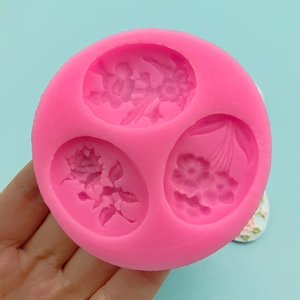 Pink silicone flower mold with three floral patterns for cake fondant and soap making