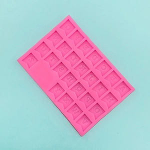 Detailed top view of pink silicone mold with A-Z alphabet letters in triangle flags