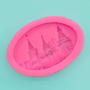 Macro view of a pink silicone mold showing detailed Russian castle patterns for baking