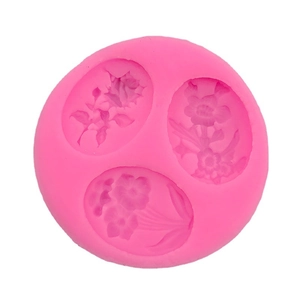 Pink silicone flower mold featuring three detailed floral patterns for baking and DIY crafts