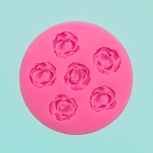 Overhead view of pink 6-cavity rose flower silicone mold for fondant or soap diy