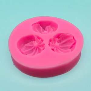 Pink silicone mold with 3 fruit and flower shapes for cake decorating and DIY crafts
