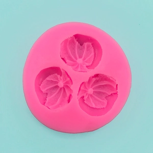 Detailed macro view of pink silicone leaf mold showing realistic vein textures