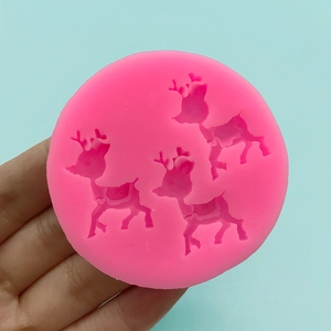 Pink silicone mold with three reindeer patterns for DIY fondant and chocolate decoration