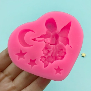 Pink heart-shaped silicone mold featuring fairy, crescent moon and stars for DIY crafts