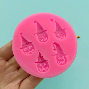 Pink silicone pumpkin mold with wizard hats for Halloween chocolate and cake decorating