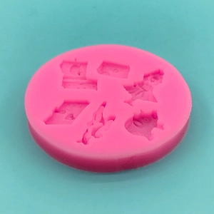 Pink silicone mold with heart and rocket shapes for DIY fondant and chocolate cake toppers