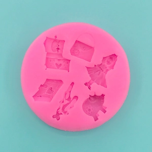 Pink silicone mold with miniature bag and silhouettes for fondant cake decoration