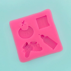 Pink silicone baby mold featuring bottle, bow, and BABY letter shapes for cake decorating