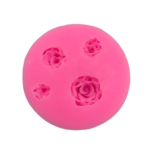 Pink round silicone mold featuring four various sized rose flower patterns for cake baking
