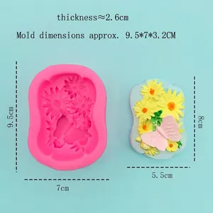 Sunflower and butterfly silicone mold for handmade soaps and resin crafts on blue background