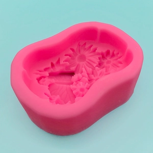 Pink silicone mold featuring sunflower and daisy designs for DIY soap and cake baking