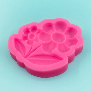 Pink flower sunflower silicone mold for cake fondant and chocolate on blue background