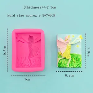 Pink silicone angel girl mold with relief finished product on light blue background