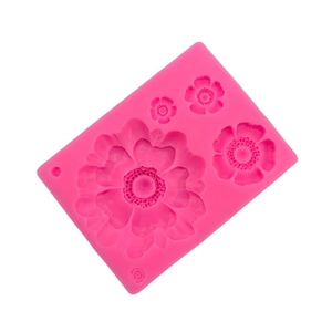 Pink silicone mold with four flower patterns for fondant chocolate and clay crafting