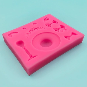 Pink silicone mold for fondant and chocolate featuring bows, flowers, and goblet shapes
