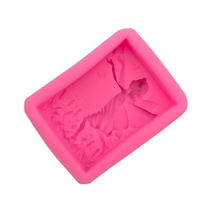 Pink silicone mold featuring a detailed angel girl design for handmade soaps and crafts
