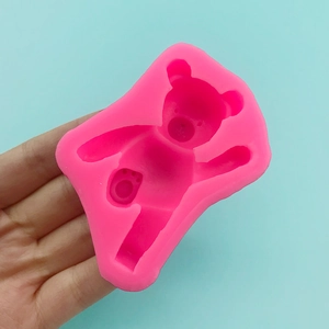 Pink silicone mold featuring a 3D teddy bear design for chocolate and DIY crafts