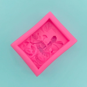 Detailed pink silicone mold featuring intricate flower and fairy relief for DIY crafts