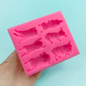 Pink silicone mold featuring various sleeping puppy designs for DIY chocolate and cake baking