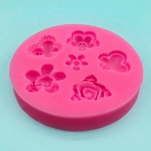 Pink silicone mold with 6 butterfly and rose flower patterns for fondant DIY cake decorating