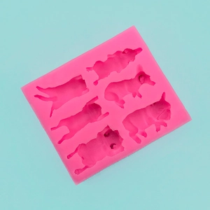 Pink silicone mold with six dog-shaped cavities for DIY chocolate and cake baking