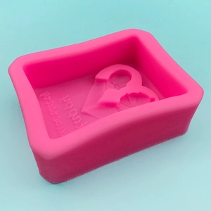 Pink heart-shaped silicone mold with wings for anniversary soap and fondant cakes