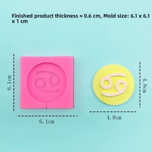 Detail view of pink silicone zodiac mold and product dimensions on a blue surface