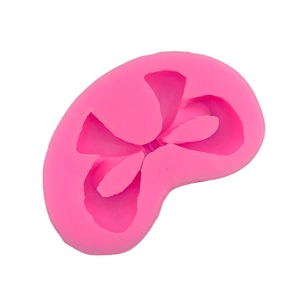 Pink silicone bow mold for DIY fondant cake decoration and baking crafts on white background