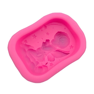 Pink silicone mold for handmade soap with sleeping baby and star pattern design