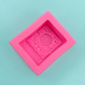 Macro shot of pink silicone sunflower mold with Life is Good text for DIY soap craft