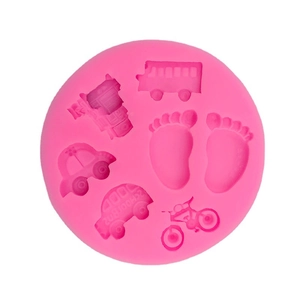 Pink silicone mold featuring school bus, car, and baby feet for DIY cake fondant and soap