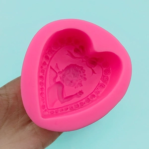 Pink heart silicone mold with angel and floral wreath for handmade soap and crafts