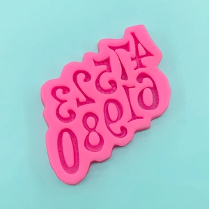 Flat lay of pink silicone mold with 0-9 numbers for DIY fondant cake and chocolate