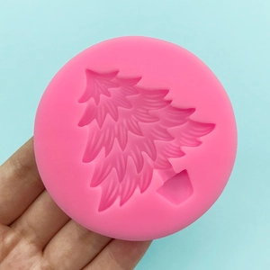 Pink silicone Christmas tree mold for baking fondant and chocolate decorations