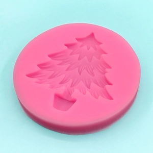 Pink silicone mold featuring a Christmas tree pattern for cake decorating and DIY crafts