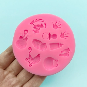 Moule en silicone rose pour fondant et chocolat avec motifs de bébé et de biberon