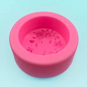Pink silicone floral mold for DIY soaps and cakes with detailed rose relief patterns