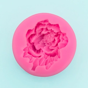 Detailed macro view of pink silicone peony mold with intricate flower petal textures
