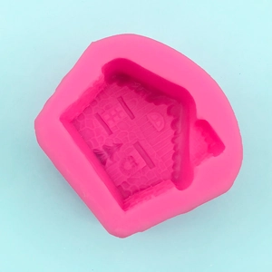 Macro shot of pink silicone mold featuring detailed stone wall texture for 3D DIY houses