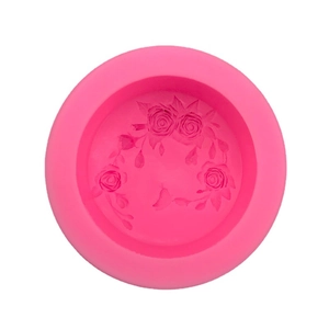 Pink silicone mold for handmade soap and cakes featuring intricate rose flower relief