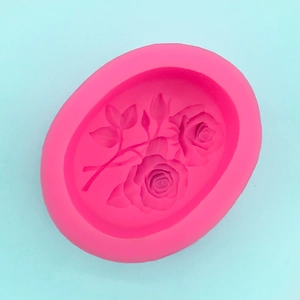 Macro detail of pink 3D rose and leaf patterns inside the silicone cake baking mold